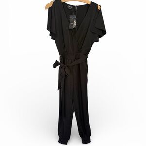 NWT Bebe Black Flutter Sleeve Wrap Satin Jumpsuit Tie Belt Size Small Polyester